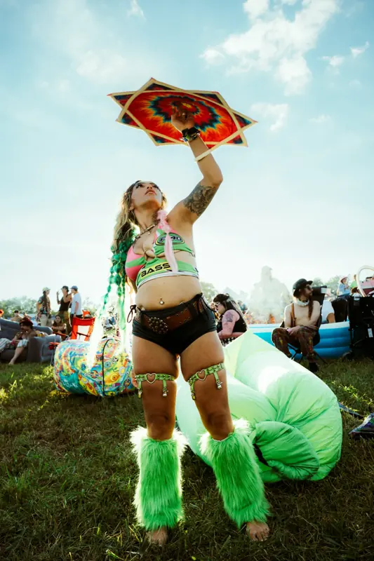 A fan raised over the crowd at golden hour at Sound Haven 2026